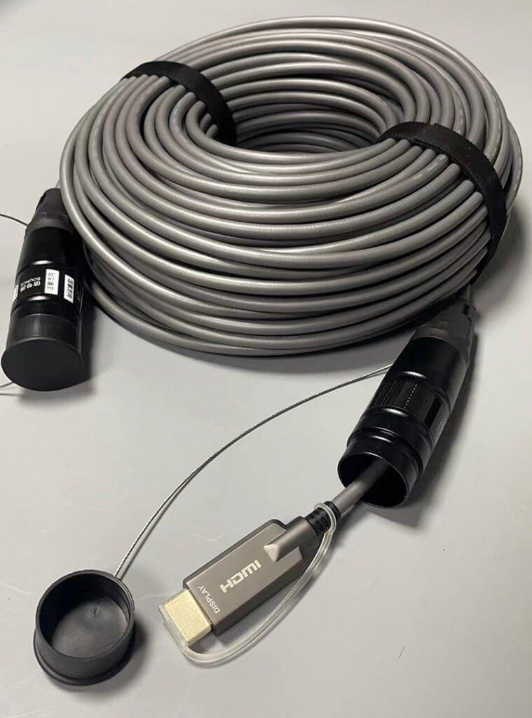 [P568FA-70M-WR] High-Speed Armored HDMI Fiber Active Optical Cable (AOC) with Hooded Connectors and Reel - 4K @ 60 Hz, HDR, IP68, M/M, Black, 70 m 